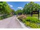 Gated entrance to the community with professional landscaping and signage at 3636 Habersham Rd # 2307, Atlanta, GA 30305