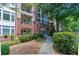 Brick apartment building featuring manicured landscaping, balconies and lots of windows at 3636 Habersham Rd # 2307, Atlanta, GA 30305