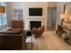 Comfortable living room with a fireplace, hardwood flooring, and neutral paint at 3636 Habersham Rd # 2307, Atlanta, GA 30305