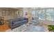 Bright living room features hardwood floors, neutral walls, and large windows at 3636 Habersham Rd # 2307, Atlanta, GA 30305