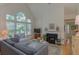 Cozy living room features a fireplace, large windows and neutral decor at 3636 Habersham Rd # 2307, Atlanta, GA 30305
