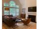 Modern living room boasts neutral color palette, fireplace and large windows at 3636 Habersham Rd # 2307, Atlanta, GA 30305