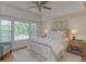 Bright main bedroom features tray ceiling, large windows, and an accent chair at 3636 Habersham Rd # 2307, Atlanta, GA 30305