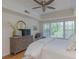 Bright main bedroom features a large dresser, ceiling fan and ensuite at 3636 Habersham Rd # 2307, Atlanta, GA 30305