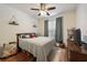 Comfortable bedroom featuring hardwood floors, soft natural light, and a ceiling fan at 4007 Westchester Ne Rdg, Atlanta, GA 30329
