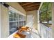 Covered patio with seating area and wooded views at 4007 Westchester Ne Rdg, Atlanta, GA 30329