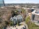 Scenic aerial view of the building showcasing nearby road and buildings, with a city view in the distance at 4007 Westchester Ne Rdg, Brookhaven, GA 30329
