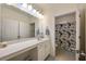 Bright bathroom featuring a spacious countertop and a view to an adjacent bath area at 4007 Westchester Ne Rdg, Brookhaven, GA 30329