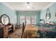 Stylish bedroom featuring natural light, a vanity and seat, and comfortable furnishings at 4007 Westchester Ne Rdg, Brookhaven, GA 30329