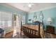 A spacious bedroom with hardwood floors, natural light, and a door that opens to the outside at 4007 Westchester Ne Rdg, Brookhaven, GA 30329