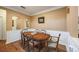 Classic dining room featuring hardwood floors, wainscoting, and a wooden table with seating at 4007 Westchester Ne Rdg, Brookhaven, GA 30329