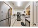 Modern kitchen with stainless steel appliances, granite countertops, and ample cabinet space at 4007 Westchester Ne Rdg, Brookhaven, GA 30329