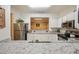 Well-lit kitchen featuring white cabinets, granite countertops, and modern appliances at 4007 Westchester Ne Rdg, Brookhaven, GA 30329