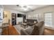 Cozy living room with ample seating, large window, ceiling fan, and access to the outdoor patio at 4007 Westchester Ne Rdg, Brookhaven, GA 30329