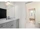 Modern bathroom featuring a gray vanity with marble countertop and sleek fixtures at 165 Breakspear Ln, Fayetteville, GA 30214