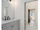 Stylish bathroom features a gray vanity, and marble countertops at 165 Breakspear Ln, Fayetteville, GA 30214