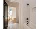 Elegant bathroom featuring white tiled walls, shower and black matte fixtures at 165 Breakspear Ln, Fayetteville, GA 30214