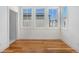 Bedroom featuring hardwood floors, white walls, and ample light at 165 Breakspear Ln, Fayetteville, GA 30214