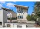 Modern home showcasing a unique architectural style with clean lines and complemented by a beautifully landscaped yard at 165 Breakspear Ln, Fayetteville, GA 30214