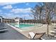 Community pool area with ample lounge chairs and manicured landscaping at 165 Breakspear Ln, Fayetteville, GA 30214