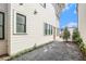 Gravel side yard showcasing the home's exterior, plantings and windows at 165 Breakspear Ln, Fayetteville, GA 30214