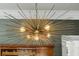 Modern chandelier with metal and starburst-style bulbs at 1696 N Pelham Ne Rd, Atlanta, GA 30324