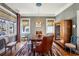 Dining room featuring windows, hardwood floors, and eclectic-style seating at 1696 N Pelham Ne Rd, Atlanta, GA 30324