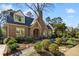 Beautiful brick home with a manicured lawn, landscaping, and inviting curb appeal at 1696 N Pelham Ne Rd, Atlanta, GA 30324