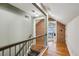 Second-story landing showcasing hardwood floors and exposed brick at 1696 N Pelham Ne Rd, Atlanta, GA 30324