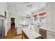 Bright kitchen with white cabinetry, stainless steel appliances, and marble countertops at 1696 N Pelham Ne Rd, Atlanta, GA 30324