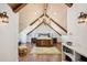 Spacious bedroom with wooden beams, chandelier, and rustic wooden bed at 1696 N Pelham Ne Rd, Atlanta, GA 30324