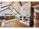 Bright bedroom with a vaulted ceiling, hardwood floors, wooden bed, and chandelier at 1696 N Pelham Ne Rd, Atlanta, GA 30324