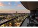 Spacious balcony with comfortable seating and panoramic skyline views at sunset at 3344 Peachtree Ne Rd # 3305, Atlanta, GA 30326