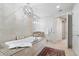 Elegant bathroom featuring a soaking tub with a granite surround and a decorative light fixture at 3344 Peachtree Ne Rd # 3305, Atlanta, GA 30326