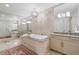 Bright bathroom boasts a soaking tub with granite, a decorative light, and ample vanity space at 3344 Peachtree Ne Rd # 3305, Atlanta, GA 30326