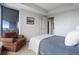 Bright bedroom boasts an armchair, and access to outdoor balcony at 3344 Peachtree Ne Rd # 3305, Atlanta, GA 30326