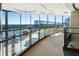 Stunning curved hallway showcasing views, glass railings, and modern design elements for sophisticated appeal at 3344 Peachtree Ne Rd # 3305, Atlanta, GA 30326