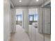 Hallway with mirrored walls leading to a bedroom with floor-to-ceiling windows and great views at 3344 Peachtree Ne Rd # 3305, Atlanta, GA 30326