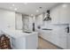 Sleek white kitchen with marble countertops, stainless steel appliances, and wooden bar stools at 3344 Peachtree Ne Rd # 3305, Atlanta, GA 30326