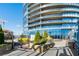 Luxury condo pool area with manicured landscaping and stylish outdoor furniture at 3344 Peachtree Ne Rd # 3305, Atlanta, GA 30326