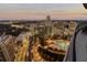 Aerial view of the rooftop pool with city views at dusk from the terrace at 3344 Peachtree Ne Rd # 3305, Atlanta, GA 30326