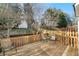 Wooden deck with chairs overlooking the spacious, wooded backyard offering a serene outdoor space at 4403 Thorngate Ln, Acworth, GA 30101