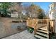 Backyard features a wooden deck, trees, shed, stone, and fence, providing privacy at 4403 Thorngate Ln, Acworth, GA 30101