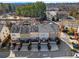 Aerial view of townhomes, showing decks and driveway parking at 4883 Seldon Se Way, Smyrna, GA 30080