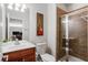 Cozy bathroom featuring a vanity, toilet, shower and a decorative guitar at 4883 Seldon Se Way, Smyrna, GA 30080