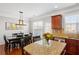 Open concept dining area with table and chairs near kitchen island at 4883 Seldon Se Way, Smyrna, GA 30080