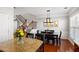 Dining area features a table with seating and stairway to upper level at 4883 Seldon Se Way, Smyrna, GA 30080