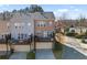 Townhome exterior displaying rear decks and driveways at 4883 Seldon Se Way, Smyrna, GA 30080