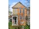 Well-manicured townhome exterior with a covered porch and classic architectural details at 4883 Seldon Se Way, Smyrna, GA 30080