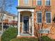 Inviting covered porch with elegant columns leading to the front door of this charming townhome at 4883 Seldon Se Way, Smyrna, GA 30080